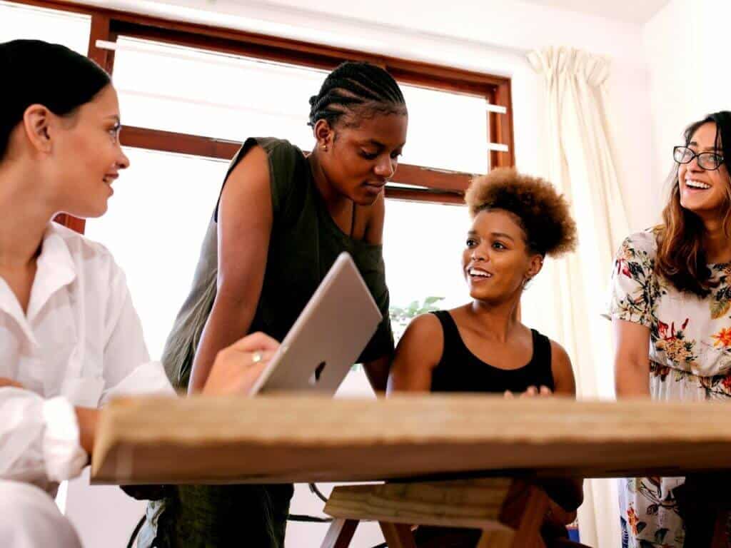 Women Sitting around a desk working